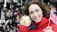 Amy Williams holding gold medal at homecoming celebrations