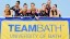 GB Senior Rhythmic Group standing by TeamBath logo banner