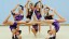 GB Senior Rhythmic Group. Team striking gymnastic poses.