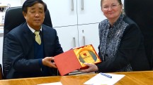 China to prepared for the 2012 Games at University of Bath. Mr Shang (left) and the Vice-Chancellor Professor Dame Glynis Breakwell