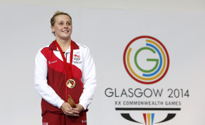 Sibhan Marie O'Connor is presented with one fo her six medals at the Glasgow 2014 Commonwealth Games on Day Four (Photo:Danny Lawson/PA Wire/Press Association Images)