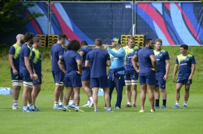 Australia's players receive instructions during training at the University of Bath