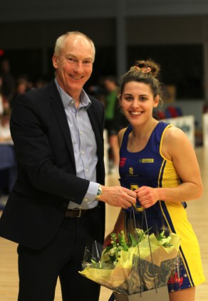 University of Bath Director of Sport Stephen Baddeley presents Mia Ritchie with her player of the match, supplied by Wild About Flowers, after the 58-28 win over Team Northumbria