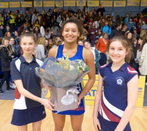 Player of the match Imogen Allison receives her Wild About Flowers bouquet from pupils of match sponsors King Edward’s School