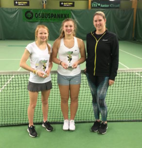 Amelia Bissett and Morgan Cross with coach Mel South after their girls' doubles title win in Finland, November 2017