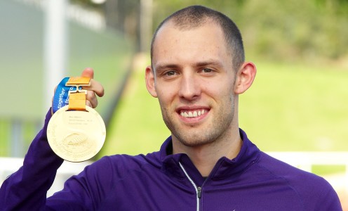 Dai Greene with his World Champ medal at the Sports Training Village