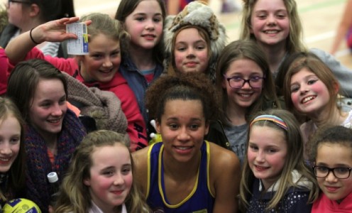 Sam Cook surrounded by Team Bath Netball fans