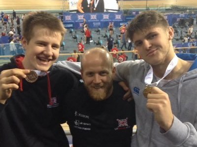 Coach Dan Harris (centre) with Marcus Whiteley and Jens Hullah, who won gold medals at the 2015 British Rowing Indoor Championships