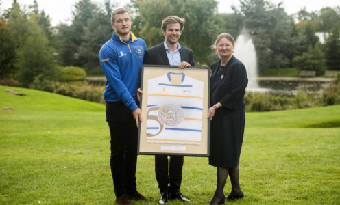 (From left) Men’s 1st XV captain Will Britton and Students’ Union Sport Officer Will Galloway present the 50th anniversary rugby shirt to Professor Dame Glynis Breakwell, Vice-Chancellor of the University of Bath. PICTURE: Clare Green for Matchtight.