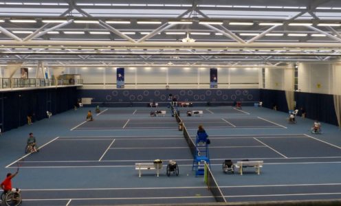 Wheelchair tennis on every court during the 2016 Bath Indoor Wheelchair Tennis Tournament, November 2016