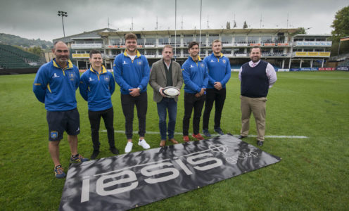 Picture of Iesis Group CEO Iestyn Lewis (centre) with (from left) University of Bath Head of Rugby Aaron James, players Douglas Crawford, Jack Davies, Charlie Dunbar and captain Will Britton, and University of Bath Deputy Director of Sport Greg Sharp launching the Anniversary Game at The Rec.