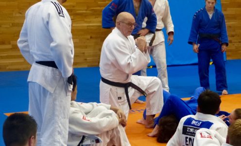 Juergen Klinger giving advice to AASE judoka during a training session in October 2017