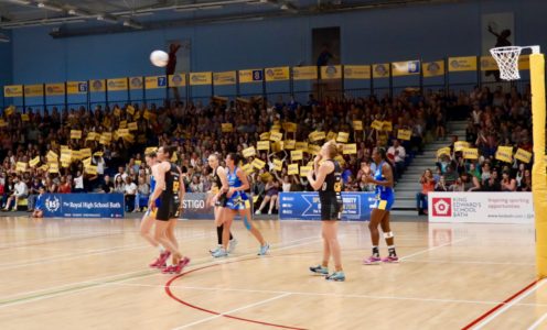 Team Bath Netball fans wave their goal cards during the Superleague match against Wasps