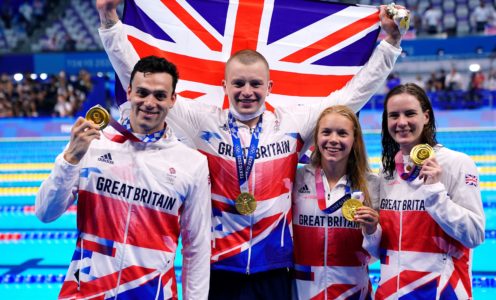 2GAGMMH Great Britain's Adam Peaty, James Guy, Anna Hopkin and Kathleen Dawson receive their Gold medals for the Mixed 4 x 100m medley relay during the swimming at the Tokyo Aquatics Centre on the eighth day of the Tokyo 2020 Olympic Games in Japan. Picture date: Saturday July 31, 2021.