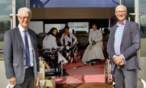 Professor Ian White, Vice-Chancellor and President of the University of Bath, and Director of Sport Stephen Baddeley visit Dimitri Coutya, Oliver Lam-Watson and Piers Gilliver during wheelchair fencing at the Team Bath Sports Training Village