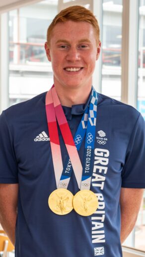 University of Bath-based swimmer Tom Dean with the two gold medals he won at the Tokyo 2020 Olympic Games in 200m freestyle and 4x200m freestyle. 