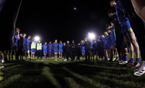 The University of Bath men's 1st XV squad huddle after their BUCS Super Rugby victory over Leeds Beckett in January 2024. CREDIT: Bob Bradford.