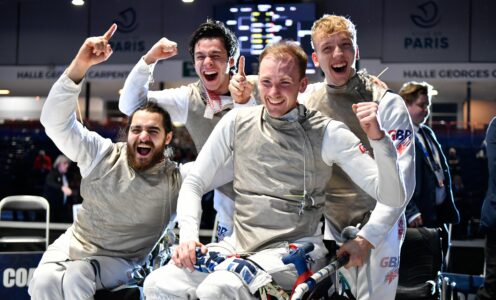 A picture of (from left) Dimitri Coutya, Oliver-Lam Watson, Piers Gilliver and Joshua Waddell celebrating after winning foil team gold at the 2024 Wheelchair Fencing European Championships in Paris.