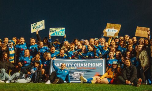 SU Bath Sport officer Abbie Watkin (front) and members of the University of Bath Women's Rugby Club celebrate Bath's Varsity victory against Cardiff Met at the Team Bath Sports Training Village on Wednesday 17th April 2024. CREDIT: Nick Perry.