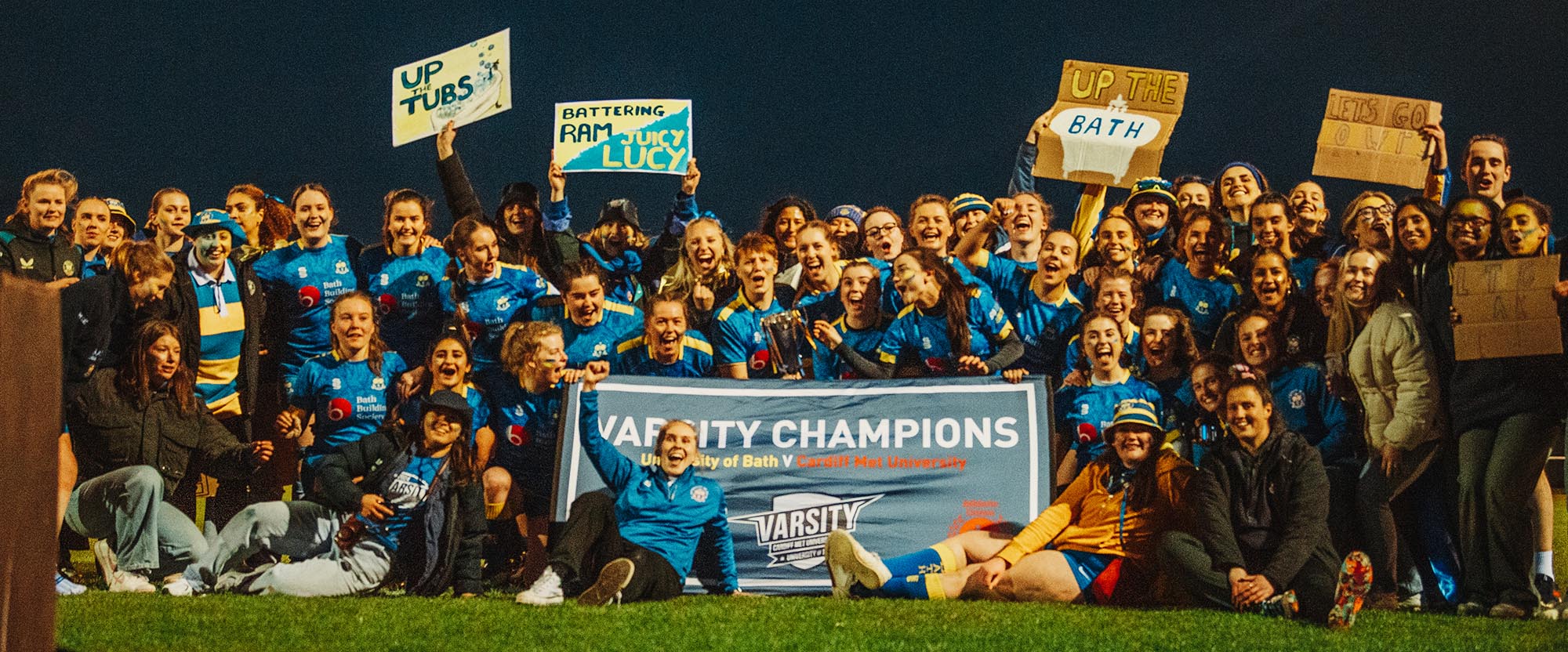 SU Bath Sport officer Abbie Watkin (front) and members of the University of Bath Women's Rugby Club celebrate Bath's Varsity victory against Cardiff Met at the Team Bath Sports Training Village on Wednesday 17th April 2024. CREDIT: Nick Perry.