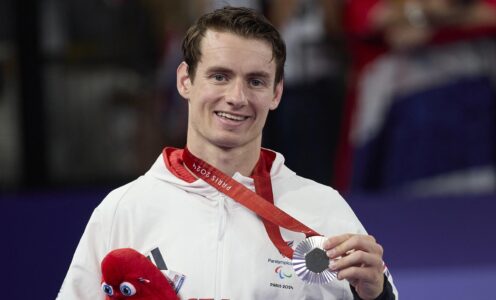 Para-badminton star Dan Bethell with the silver medal he won in the men's SL3 singles final at the Paris 2024 Paralympic Games. CREDIT: imagecomms