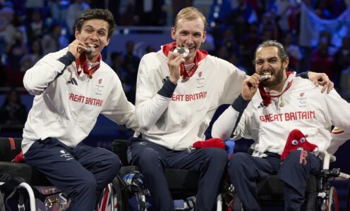 Oliver Lam-Watson, Piers Gilliver and Dimitri Coutya celebrate after winning wheelchair fencing men's team foil silver at the Paris 2024 Paralympic Games. CREDIT: imagecomms