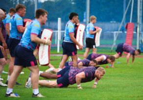 Wigan Warriors training on the athletics infield during a three-day camp at the University of Bath in September 2024.