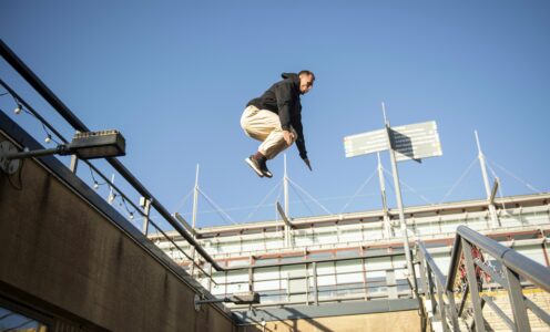 A picture of Ukraine's Bohdan Kolmakov leaping in front of the library during a Parkour demonstration at the University of Bath