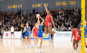 A picture of Team Bath Netball shooter Lily Jones under pressure from the Nottingham Forest goal keeper during the first-ever NXT Gen League match on Friday 7th February 2025.
