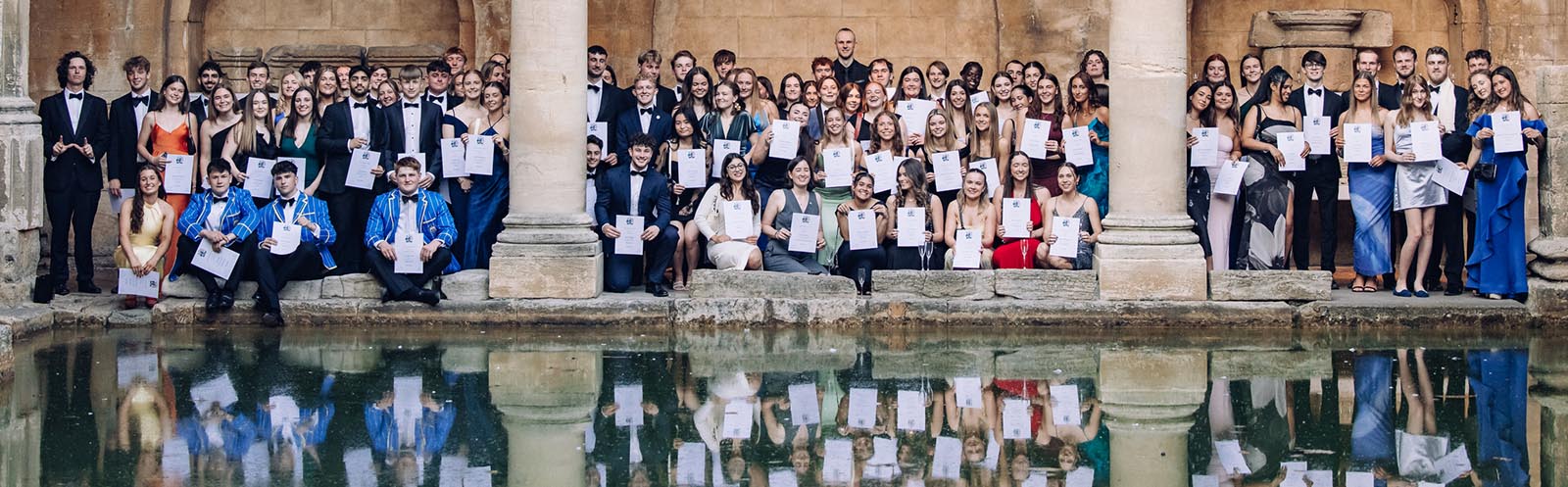 A photo of Blues Awards 2025 winners holding their certificates at the Roman Baths