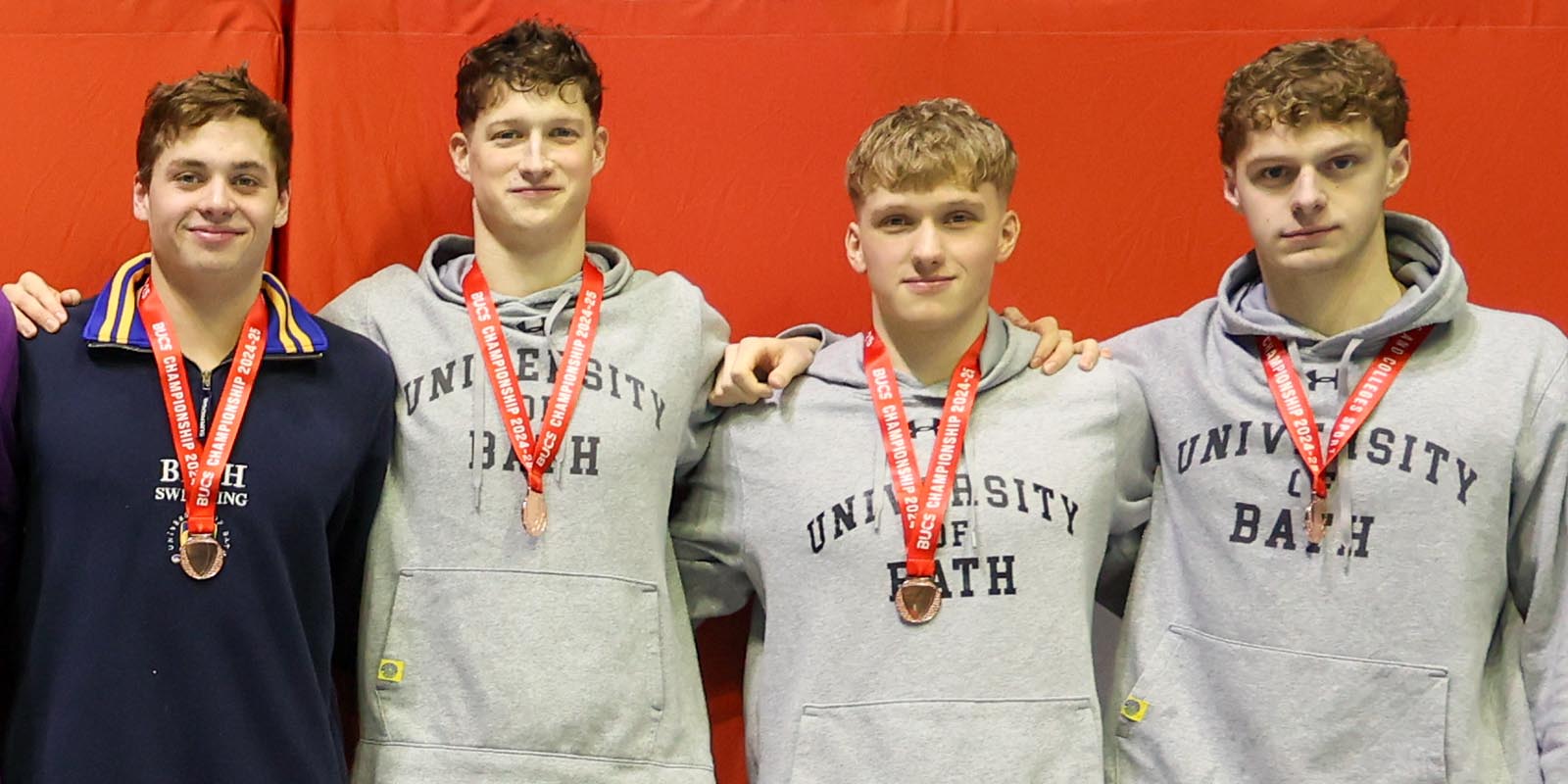 A photo of (from left) University of Bath student swimmers Matthew Ward, Cam Brooker, Joshua Gammon and Jack Skerry with the relay bronze medals they won at BUCS Nationals 2025. The photo was taken by Adam Bates for BUCS.