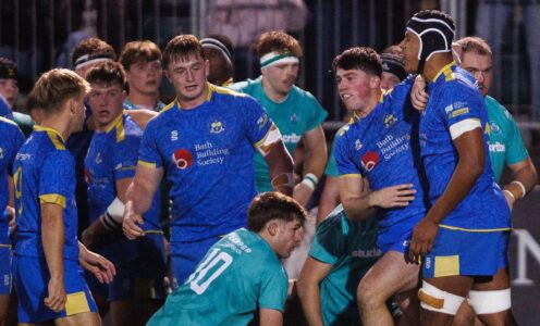 Rugby players from the University of Bath, in blue, and University of Exeter, in green