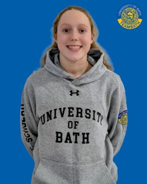 A cut-out image of University of Bath 2025-26 sporting scholar Cara Zeidler on a blue background with a Team Bath logo in the top right corner.