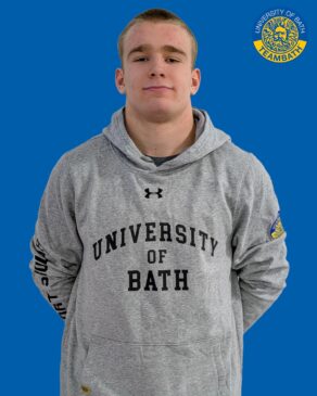 A cut-out image of University of Bath 2025-26 sporting scholar George Riley on a blue background with a Team Bath logo in the top right corner.