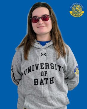 A cut-out image of University of Bath 2025-26 sporting scholar Maria Slade on a blue background with a Team Bath logo in the top right corner.