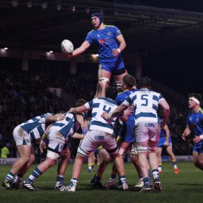 A University of Bath forward is lifted high above several Exeter players to win a lineout