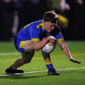 University of Bath Rugby Club player Roman Andrews bends down to score a try 