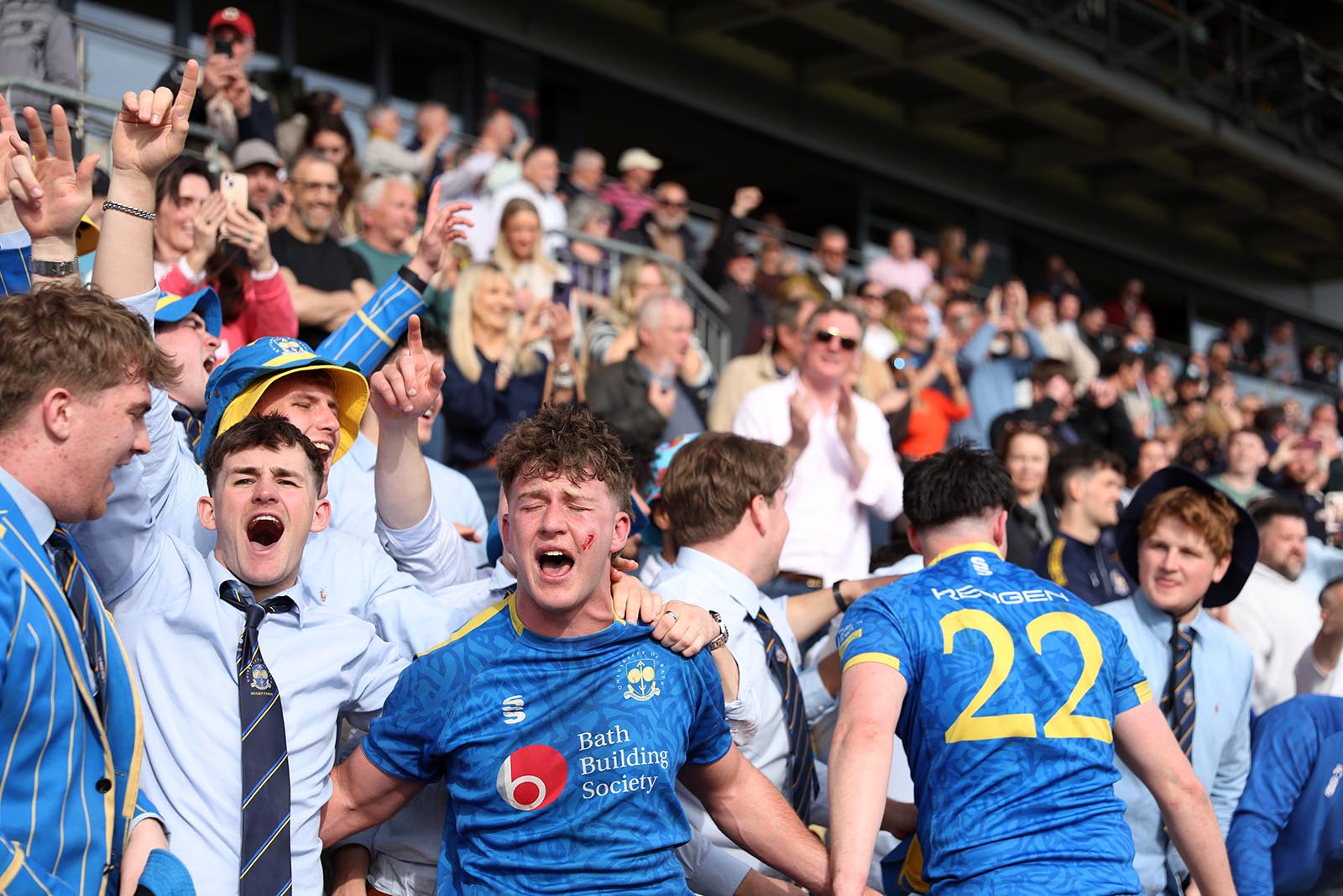 University of Bath men's 1st XV player Iwan Coyle celebrates with the travelling fans after the 2026 BUCS Super Rugby Milk Championship final