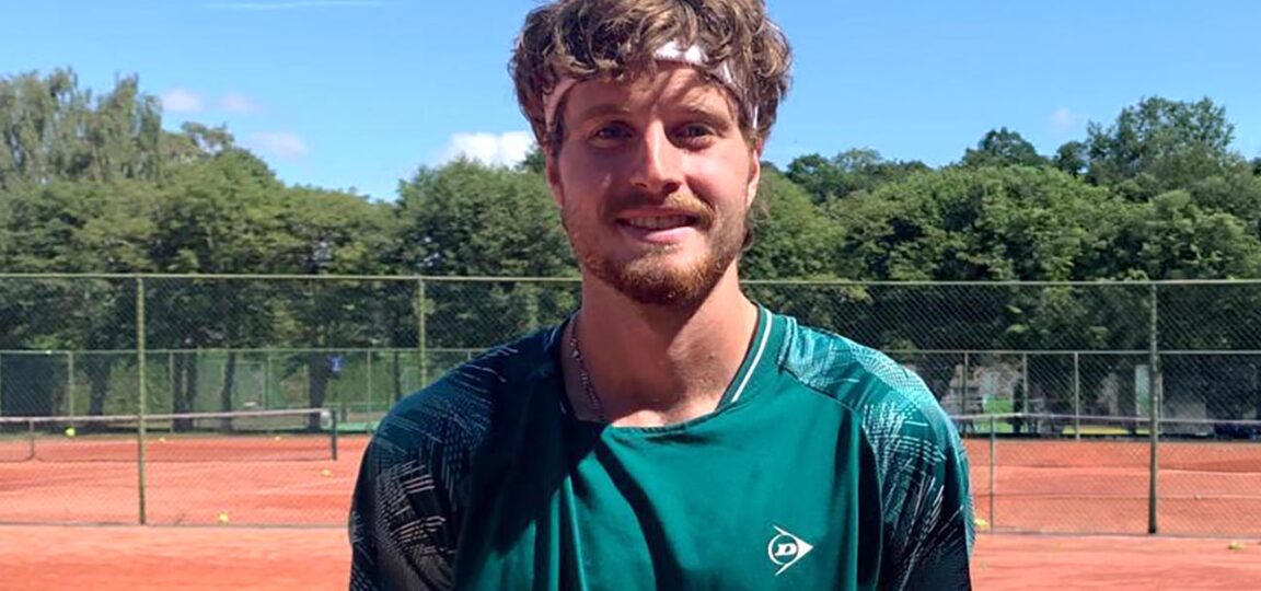 A profile picture of Toby Samuel on the outdoor tennis courts at the University of Bath, where he trains.