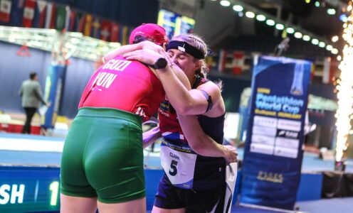 Poppy Clark is hugged by race winner Blanka Guzi after finishing runner-up at the UIPM Pentathlon World Cup in Budapest in June 2026