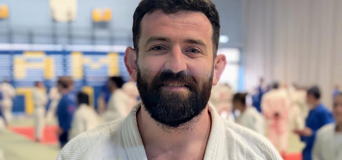 A headshot of Team Bath Judo coach Adam Hall.