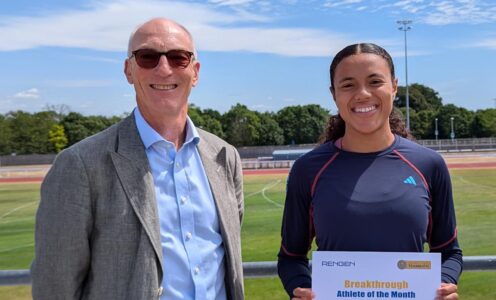 Stephen Baddeley standing next to Aleeya Sibbons, who is holding an Athlete of the Month certificate