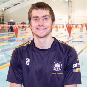 Swimmer Isaac Dodds with the University of Bath pool behind him.