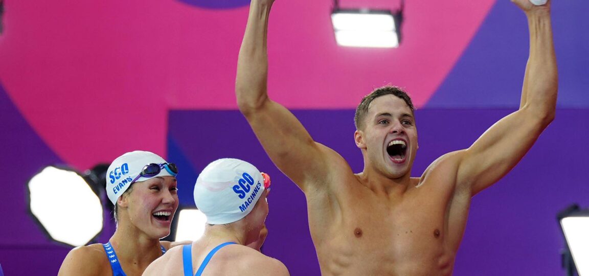 Matthew Ward punches the air in delight after helping Team Scotland win medley relay bronze at Glasgow 2026