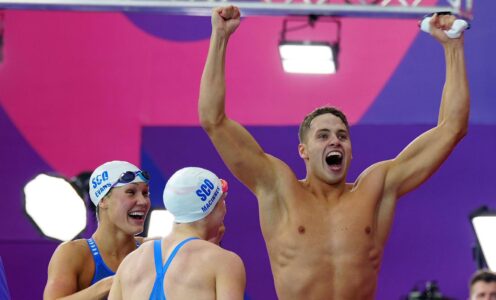 Matthew Ward punches the air in delight after helping Team Scotland win medley relay bronze at Glasgow 2026