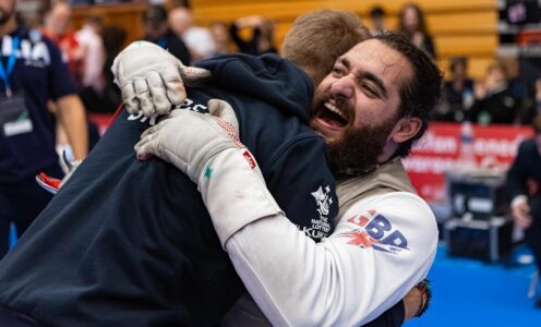 Para fencer Dimitri Coutya roaring with delight and hugging a coach after winning European gold in Cardiff